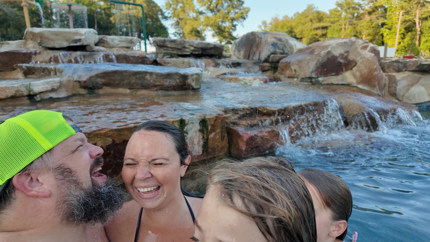 Family enjoying the swimming pool at Sanwar RV Park Resort in Sandersville, Georgia