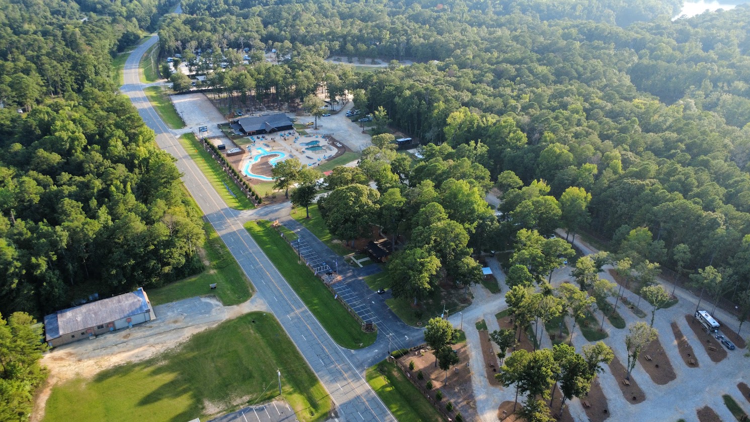 Drone view of Sanwar RV Park Resort and its RV sites surrounded by Georgia woodland