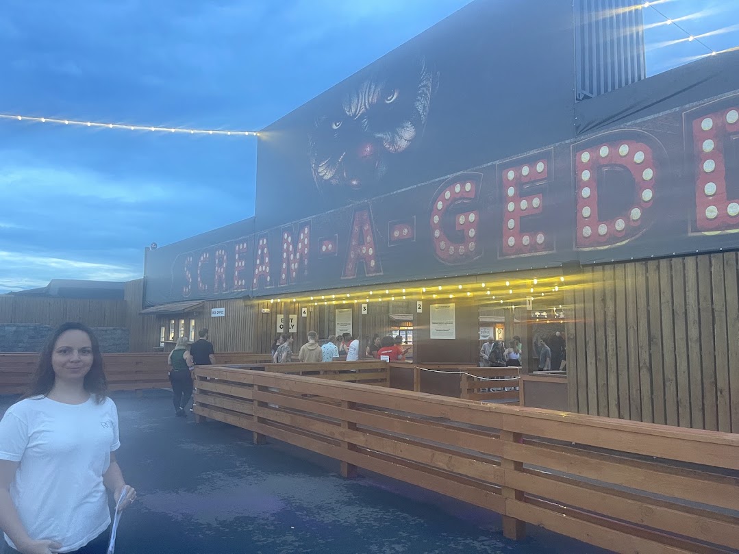 Scream-A-Geddon ticket entrance with illuminated sign at dusk